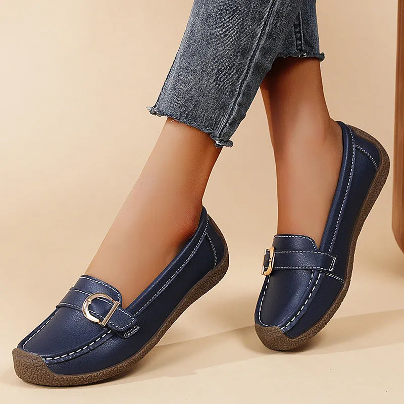 Women's beige casual loafers with round toe and flat beef tendon sole on a white background.