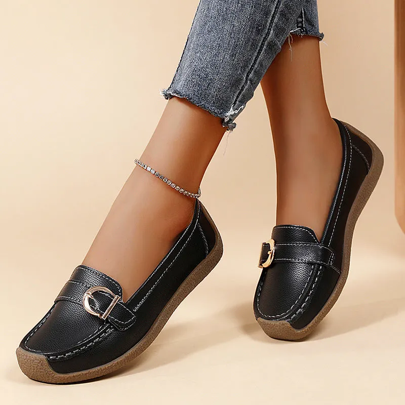 Women's beige casual loafers with round toe and flat beef tendon sole on a white background.