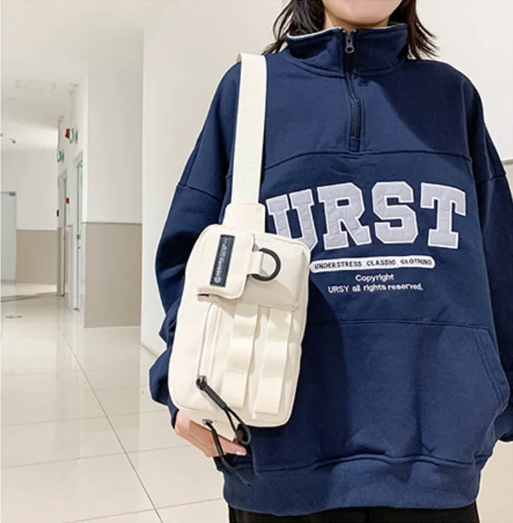 Tooling style crossbody bag in solid colour with wear-resistant nylon for outdoor sports use, below 20L capacity