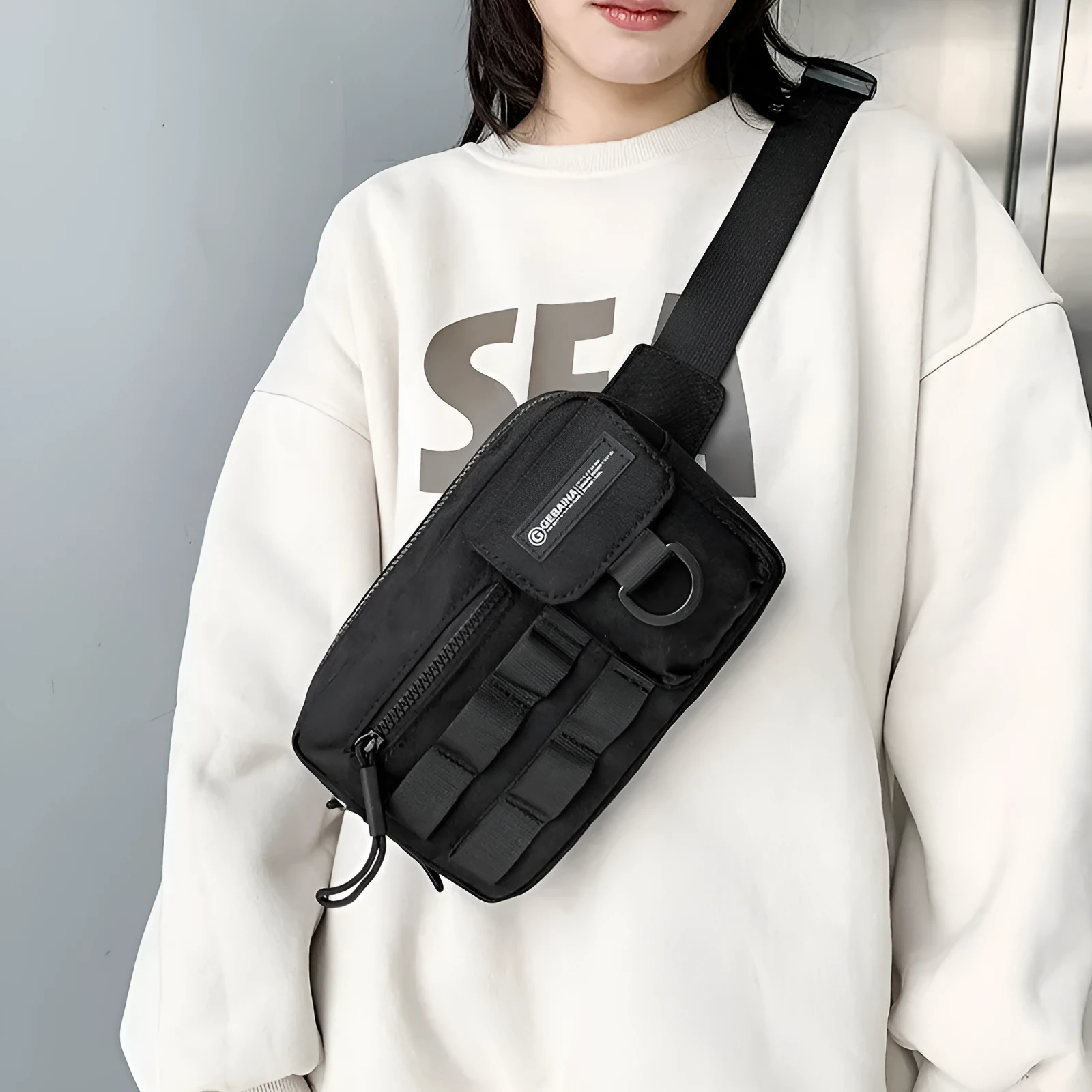 Tooling style crossbody bag in solid colour with wear-resistant nylon for outdoor sports use, below 20L capacity