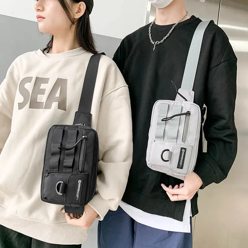 Tooling style crossbody bag in solid colour with wear-resistant nylon for outdoor sports use, below 20L capacity