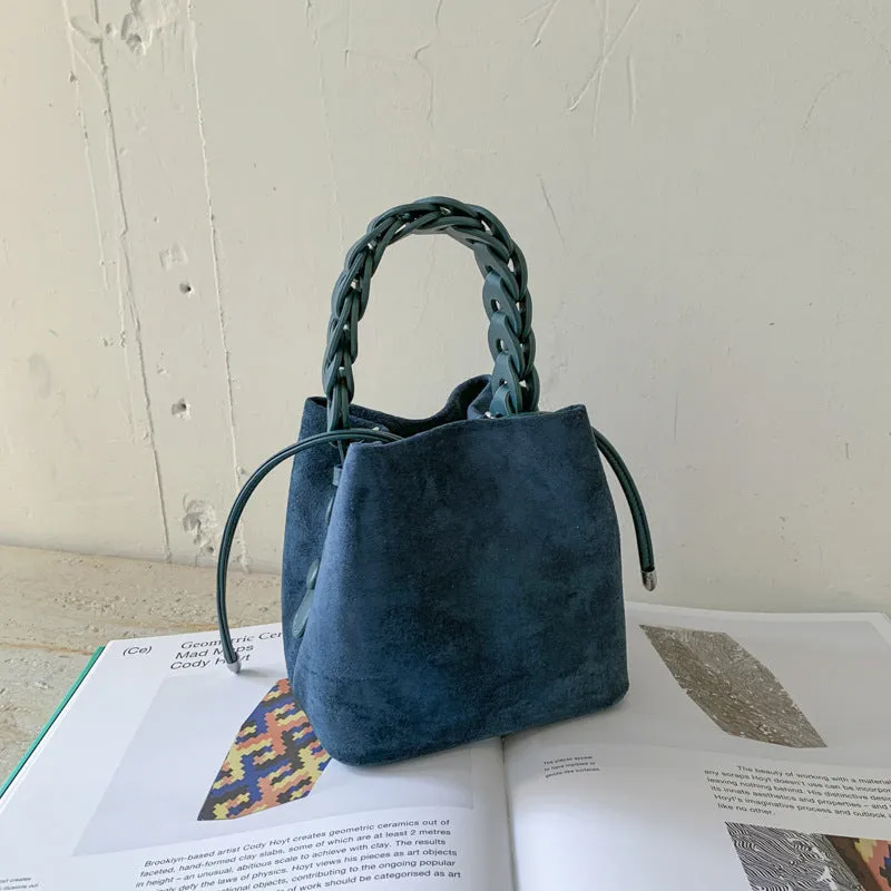 Fashion suede crossbody bag with stitching details, PU material, available in multiple colours like watermelon red and brown