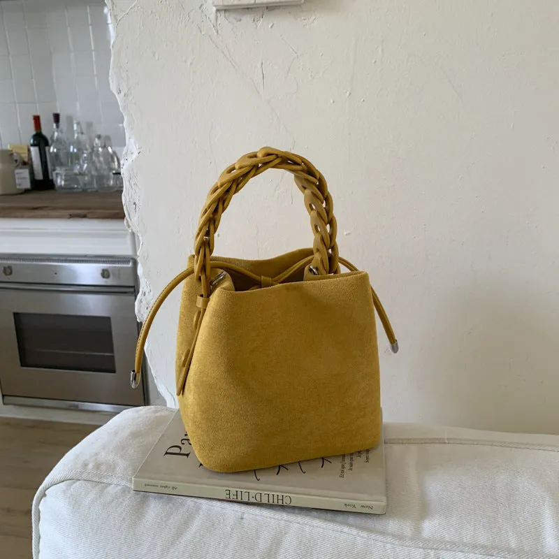 Fashion suede crossbody bag with stitching details, PU material, available in multiple colours like watermelon red and brown