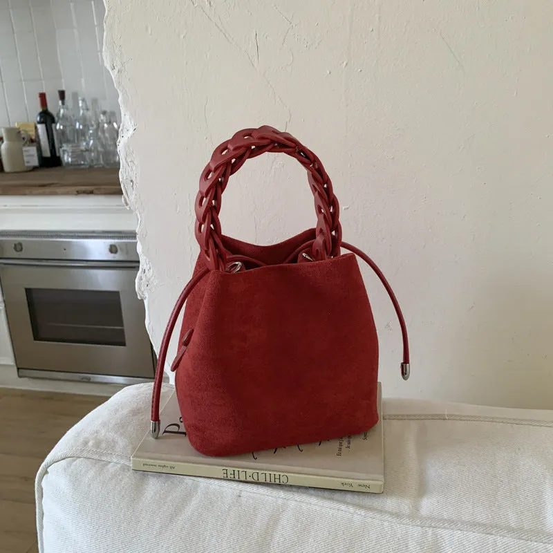 Fashion suede crossbody bag with stitching details, PU material, available in multiple colours like watermelon red and brown