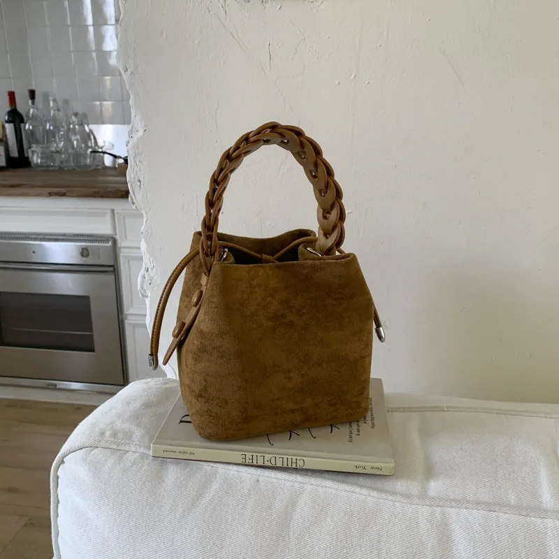 Fashion suede crossbody bag with stitching details, PU material, available in multiple colours like watermelon red and brown