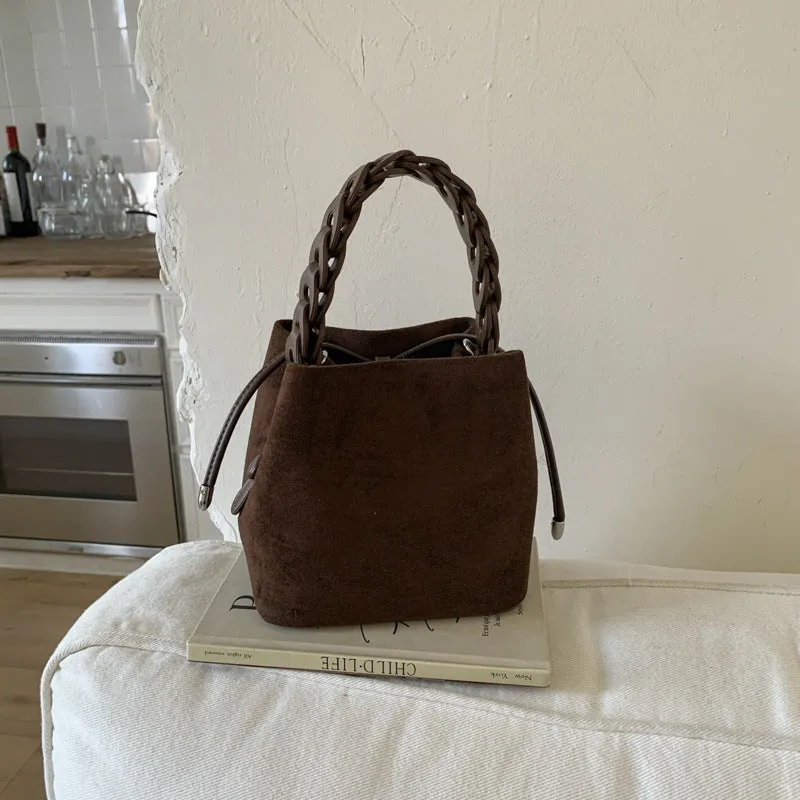 Fashion suede crossbody bag with stitching details, PU material, available in multiple colours like watermelon red and brown