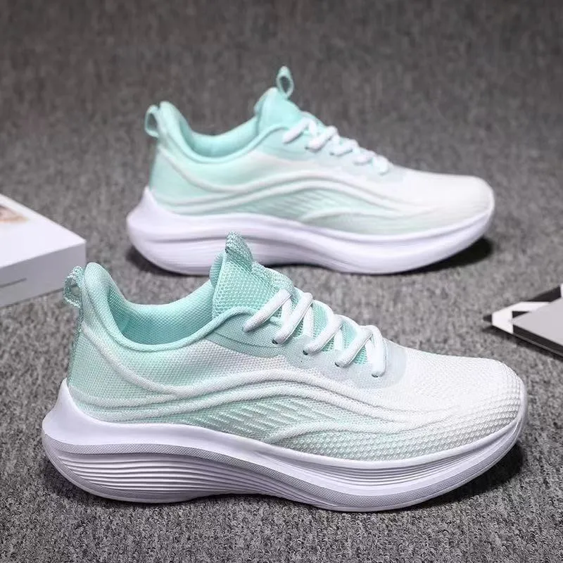 Women's lightweight running shoes with breathable mesh upper, flat heel, and front lace-up closure
