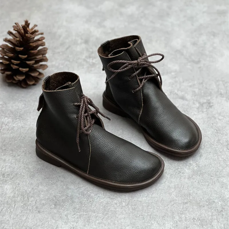 Retro genuine leather Martin boots for women in black, flat heel, round toe, front tie strap.