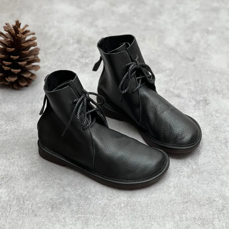 Retro genuine leather Martin boots for women in black, flat heel, round toe, front tie strap.