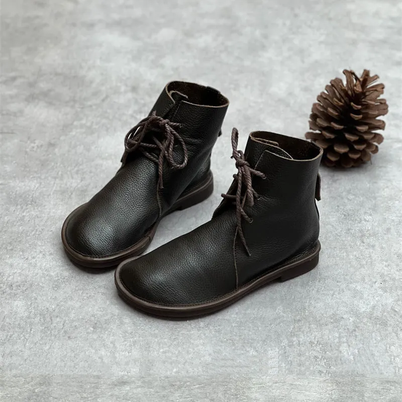 Retro genuine leather Martin boots for women in black, flat heel, round toe, front tie strap.