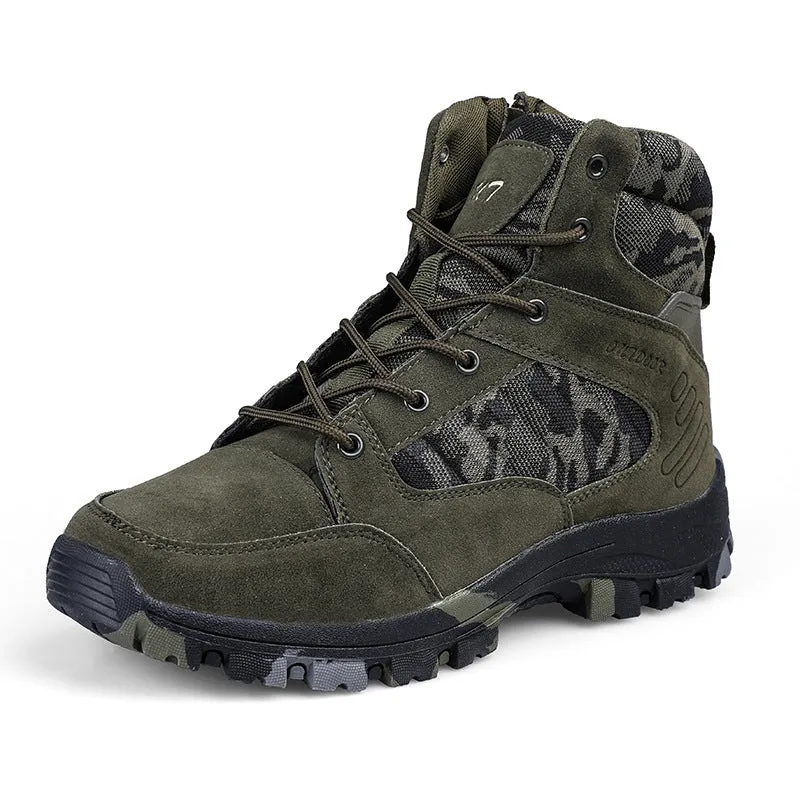 Men's black high-top hiking shoe with metal detail on a rugged outdoor surface