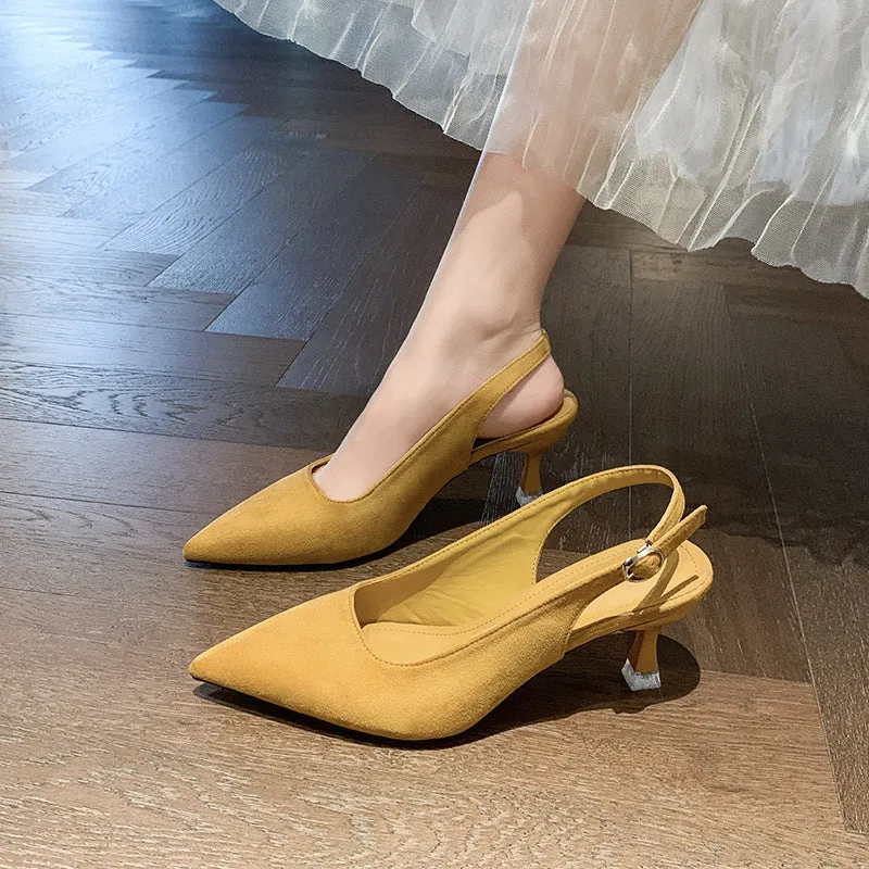 A pair of apricot-coloured suede pointed-toe stiletto high heels with a rubber sole.