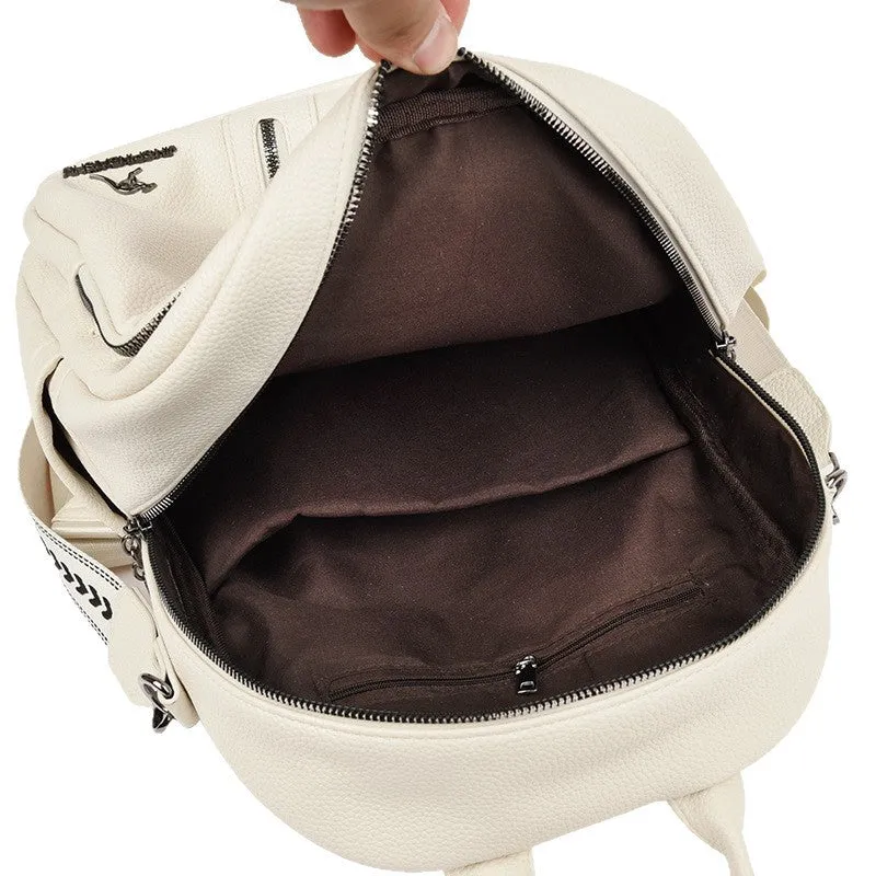 Genuine leather geometric patchwork student backpack with metal belt decoration, waterproof and wear-resistant, in black beige and yellow