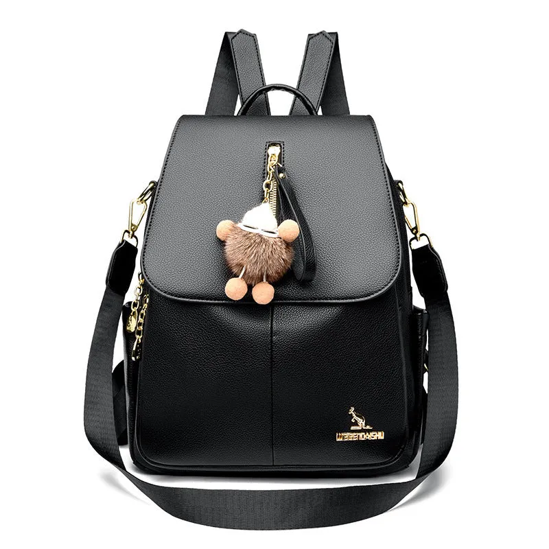 Genuine leather backpack with pendant and spliced belt detail for students and travellers, available in beige