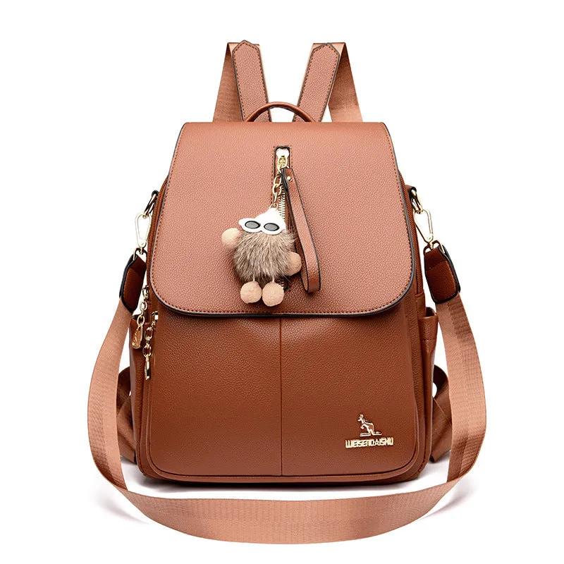Genuine leather backpack with pendant and spliced belt detail for students and travellers, available in beige