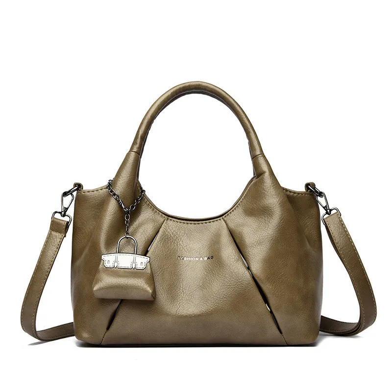 Trendy niche women's new shoulder bag in genuine leather with dumpling shape and pleated detail, khaki colour