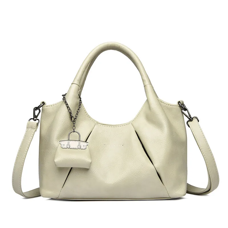 Trendy niche women's new shoulder bag in genuine leather with dumpling shape and pleated detail, khaki colour