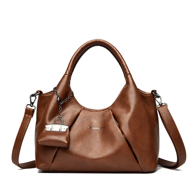 Trendy niche women's new shoulder bag in genuine leather with dumpling shape and pleated detail, khaki colour