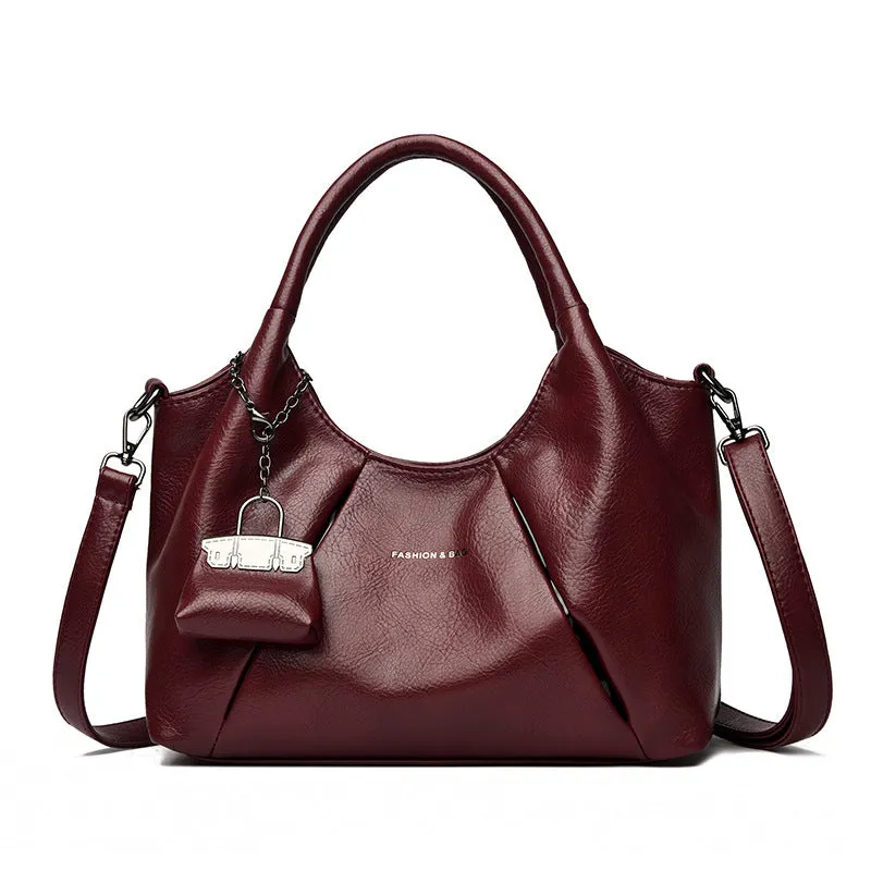 Trendy niche women's new shoulder bag in genuine leather with dumpling shape and pleated detail, khaki colour