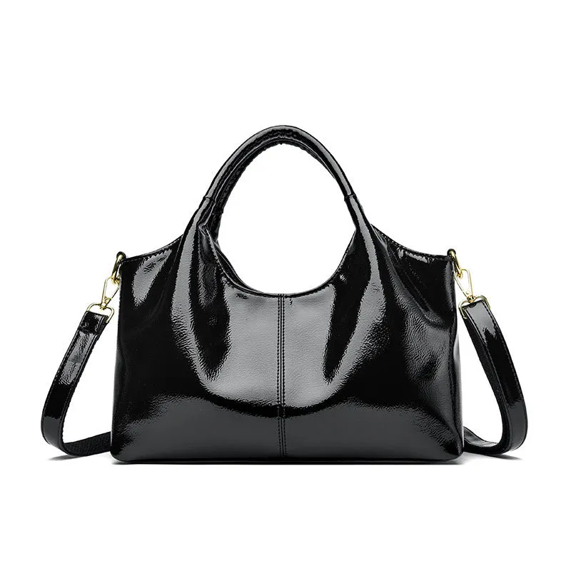 Genuine leather commuter bag with glossy finish, belt decoration, and leather grain in a horizontal square shape