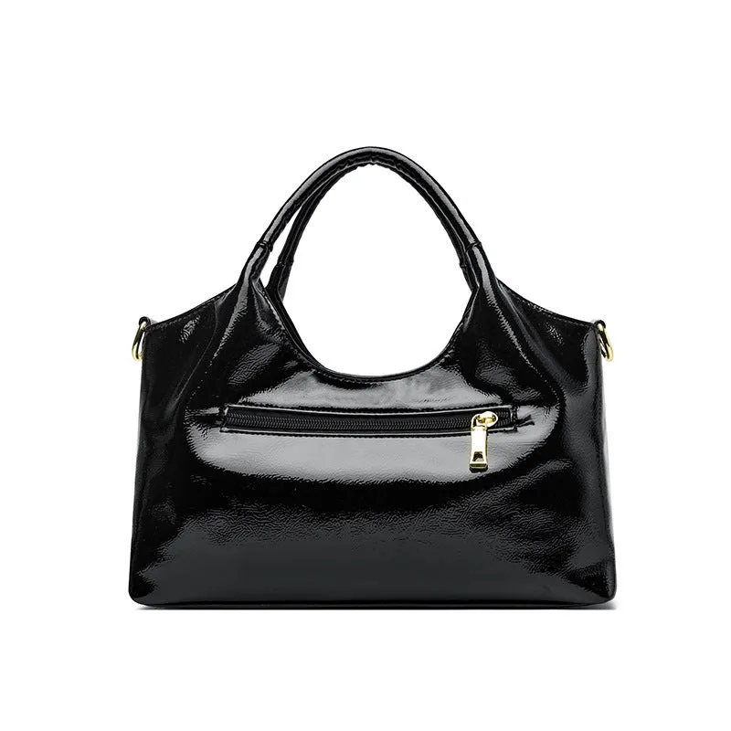 Genuine leather commuter bag with glossy finish, belt decoration, and leather grain in a horizontal square shape