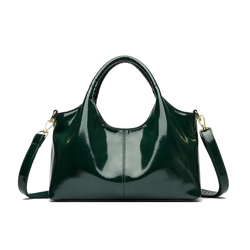 Genuine leather commuter bag with glossy finish, belt decoration, and leather grain in a horizontal square shape