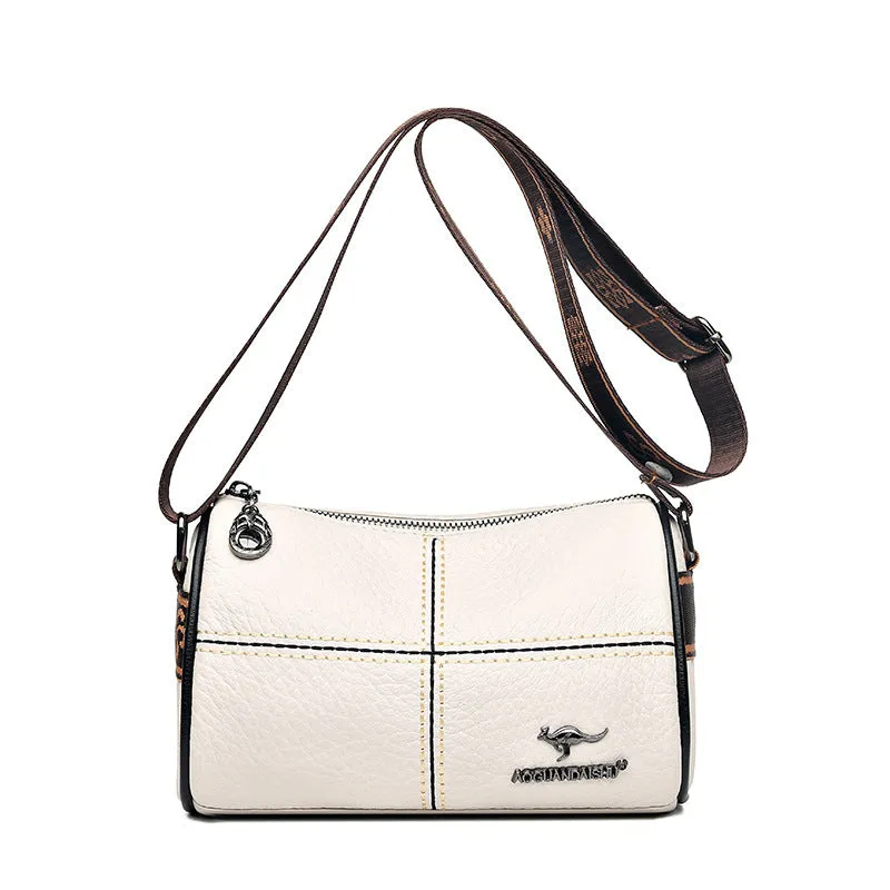 Women's casual stitched genuine leather shoulder bag in cylindrical shape, available in black, brown, green, and white