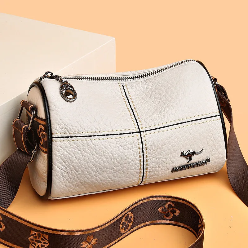 Women's casual stitched genuine leather shoulder bag in cylindrical shape, available in black, brown, green, and white