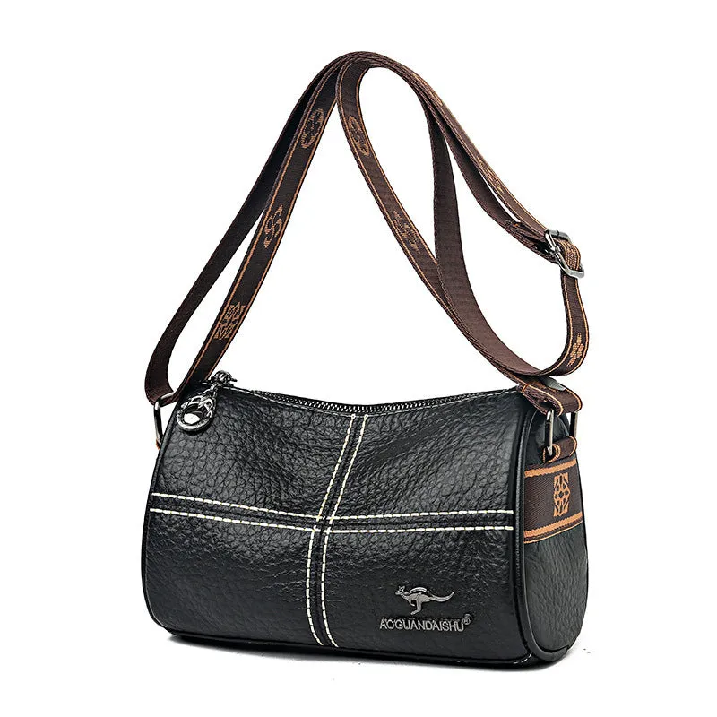 Women's casual stitched genuine leather shoulder bag in cylindrical shape, available in black, brown, green, and white