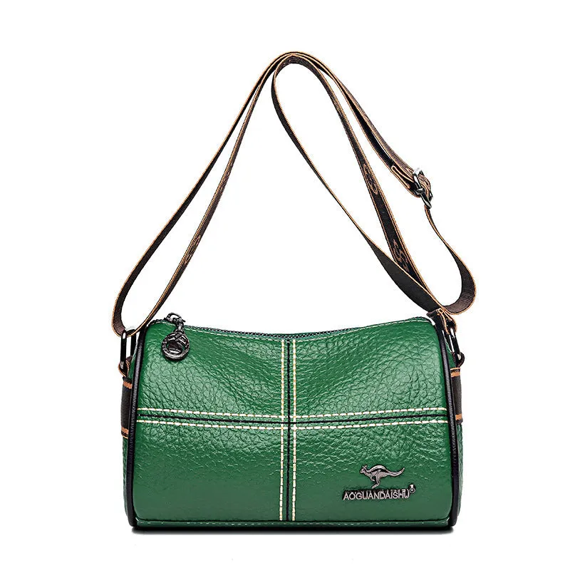 Women's casual stitched genuine leather shoulder bag in cylindrical shape, available in black, brown, green, and white