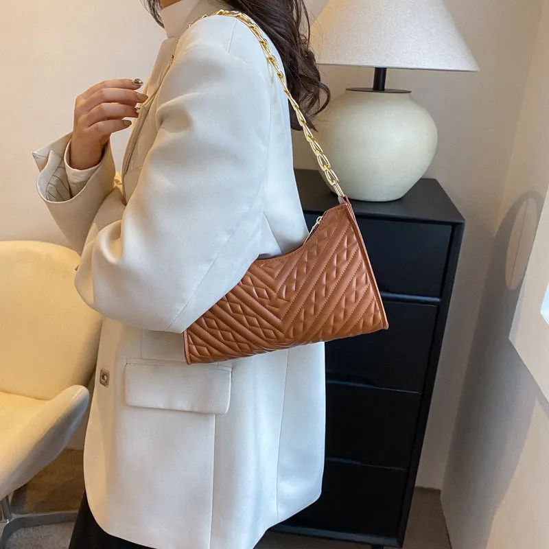 Brown pleated PU chain baguette shoulder bag showing square shape and soft handles.