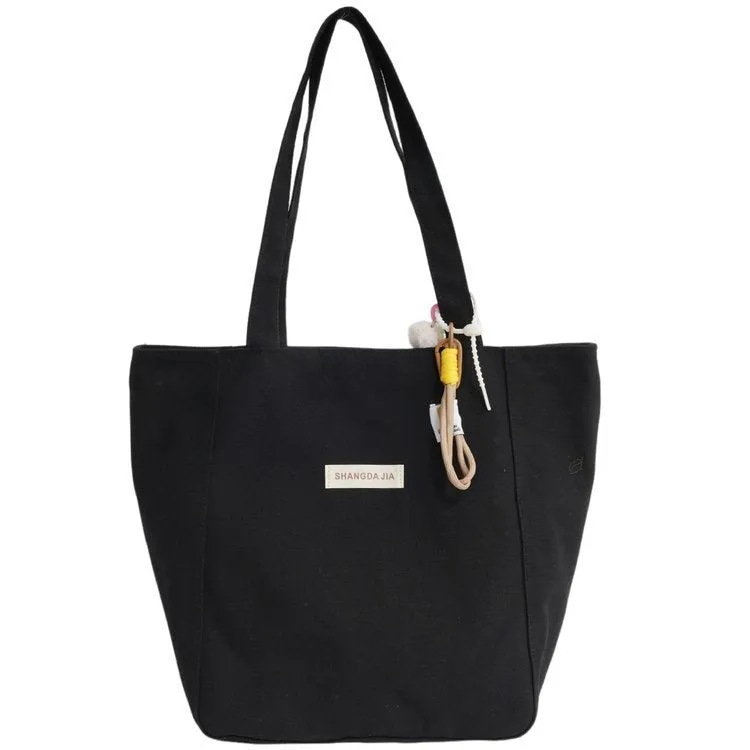 Canvas casual large capacity shoulder bag for women in four colours with pendant options