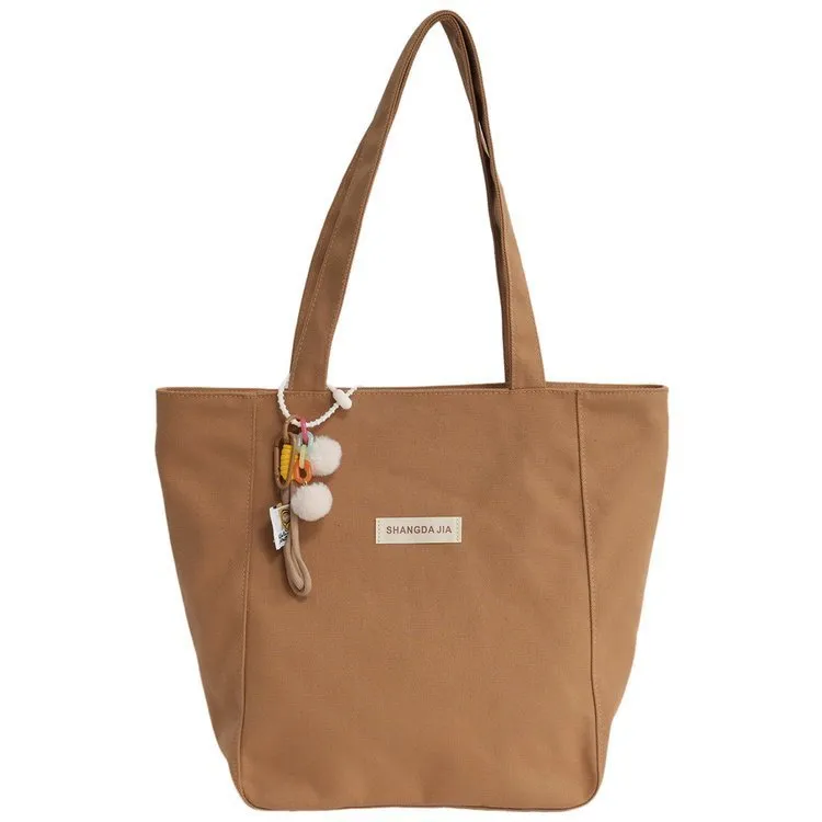 Canvas casual large capacity shoulder bag for women in four colours with pendant options