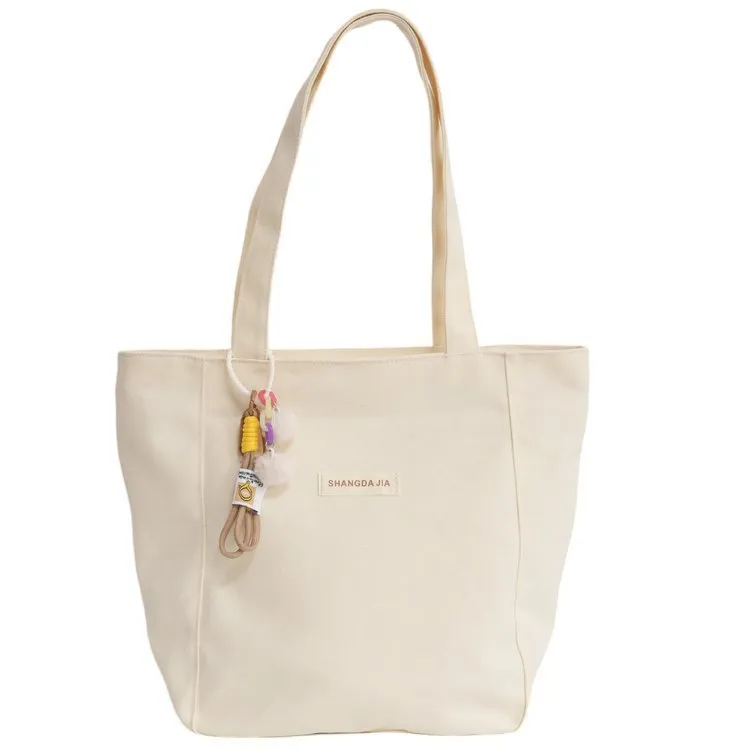 Canvas casual large capacity shoulder bag for women in four colours with pendant options