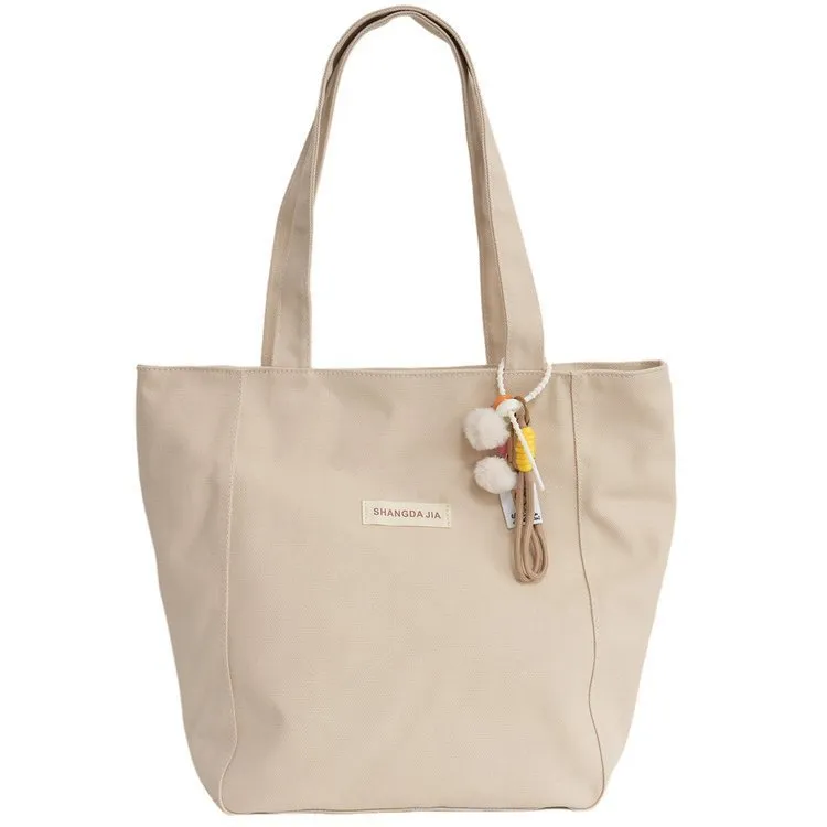 Canvas casual large capacity shoulder bag for women in four colours with pendant options
