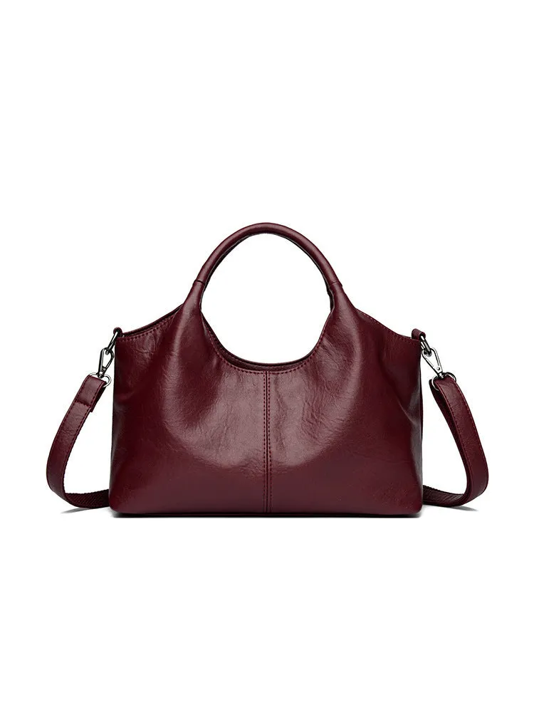 Genuine leather women's crossbody bag in beige colour showing large capacity design
