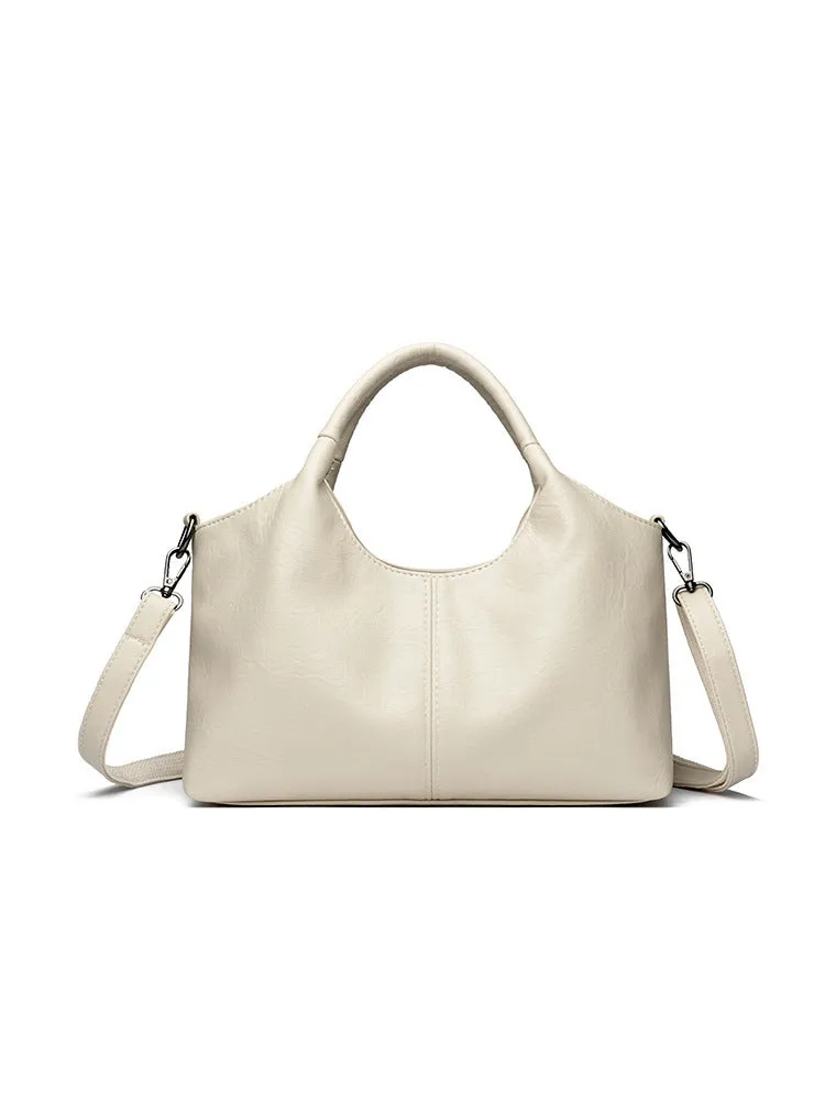 Genuine leather women's crossbody bag in beige colour showing large capacity design