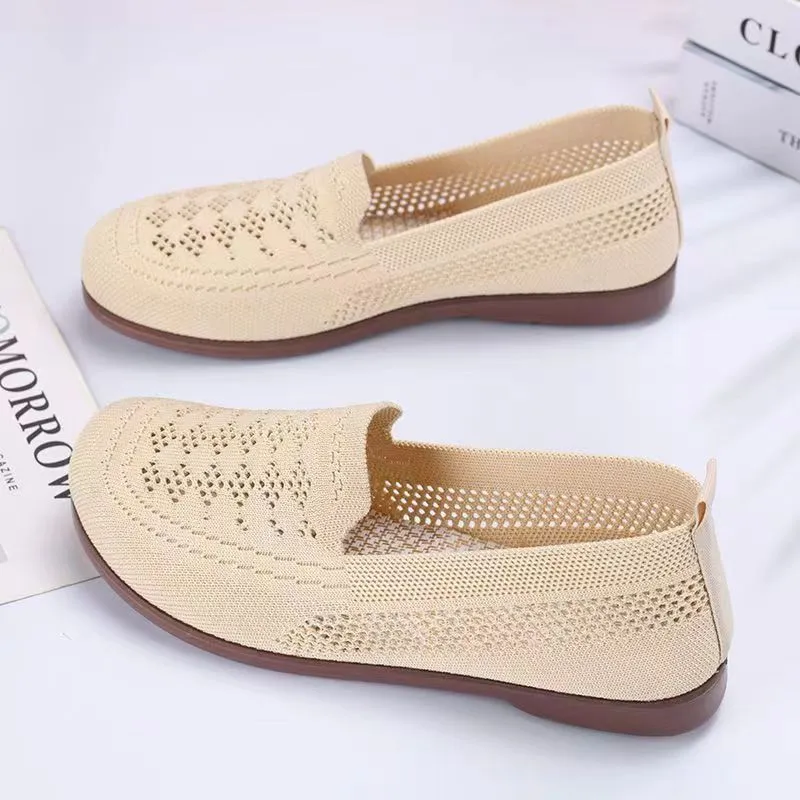Women's beige low-top casual slip-on shoes with mesh upper and round toe.