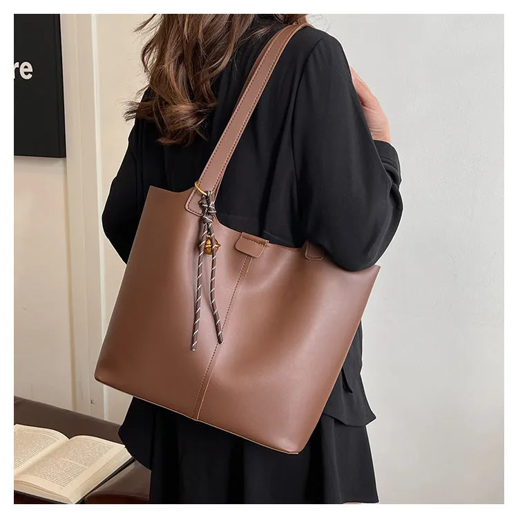 Fashionable PU leather commuter shoulder bag in brown with pendant, horizontal square shape, synthetic leather lining