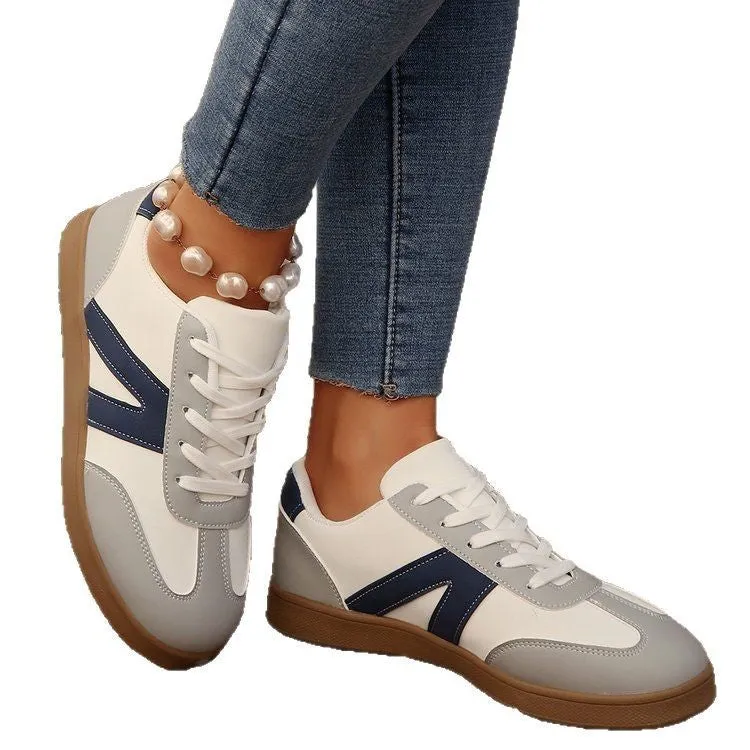 Blue women's low-top hiking training shoes with a lace-up front and rubber sole.