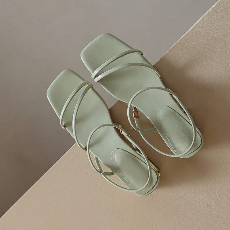 Women's flat strap gladiator sandals with square toe and adjustable ankle ties in beige.