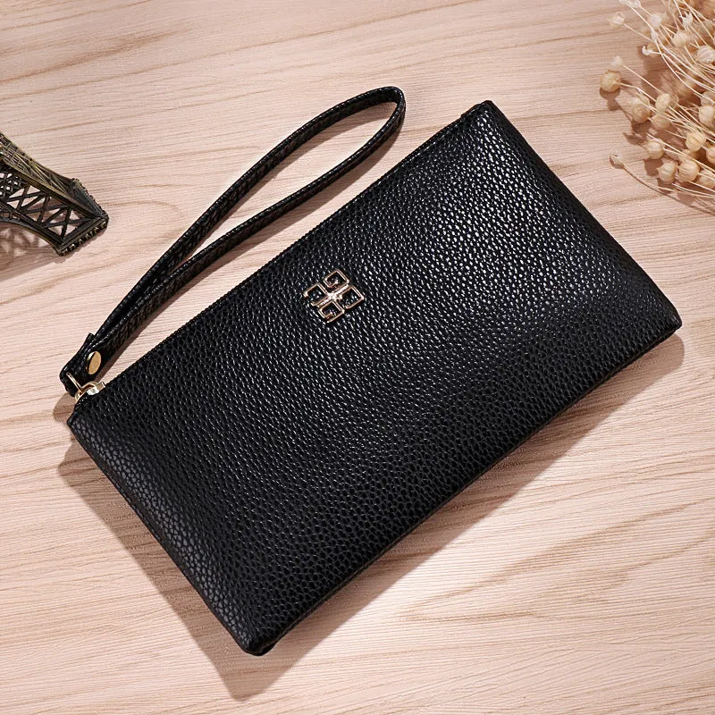 Long 55-inch PU leather zip wallet handbag in a solid colour with sewing line detail.