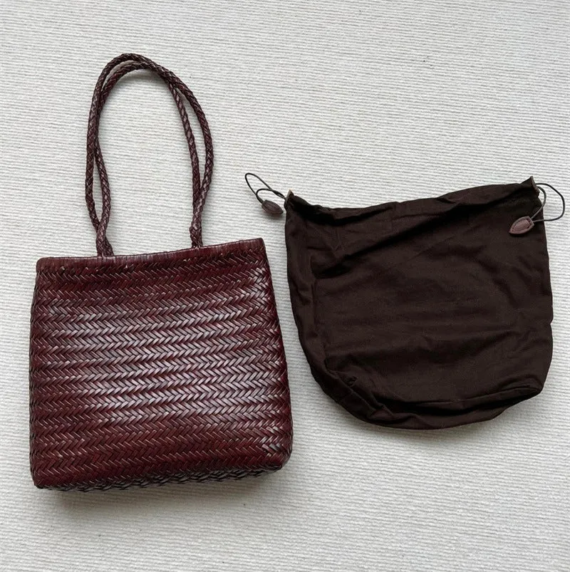 Handmade brown woven cowhide leather tote bag with a structured front pocket.