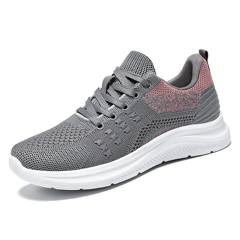 Women's low-top lace-up sneakers in black mesh with a soft PVC sole.