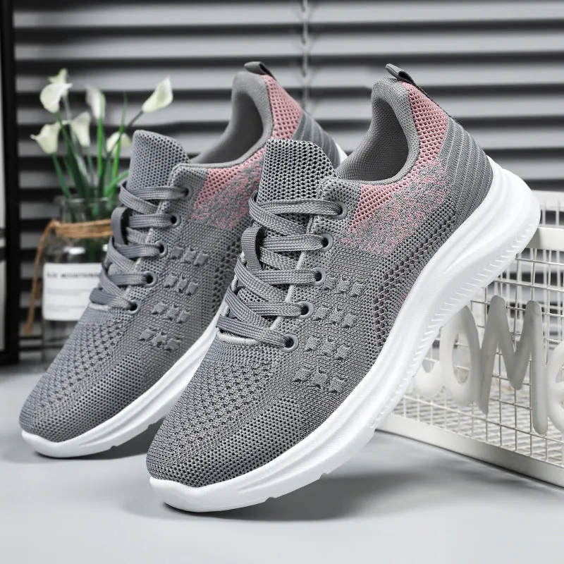Women's low-top lace-up sneakers in black mesh with a soft PVC sole.