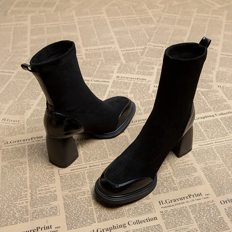 Genuine leather women's short martin boots in black matte finish with high heel and rubber sole
