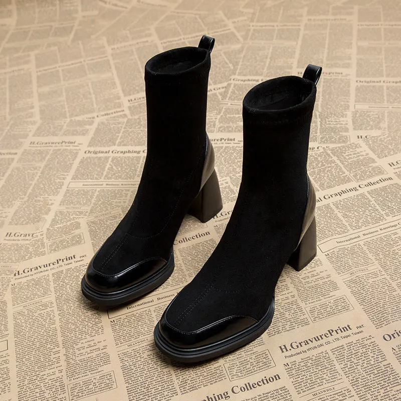 Genuine leather women's short martin boots in black matte finish with high heel and rubber sole