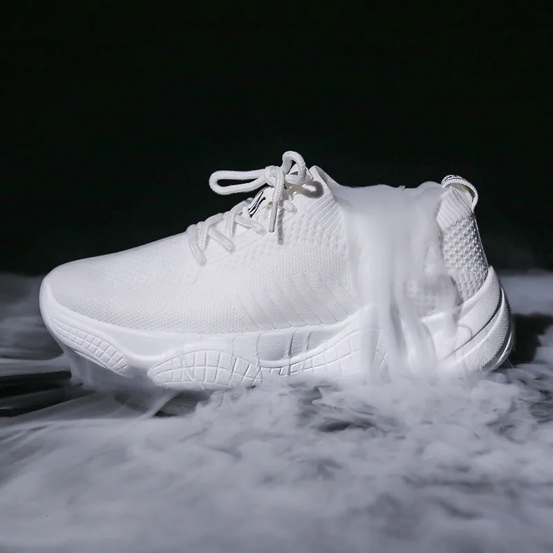 White thick-soled women's flyknit trainers with front strap and rubber sole.