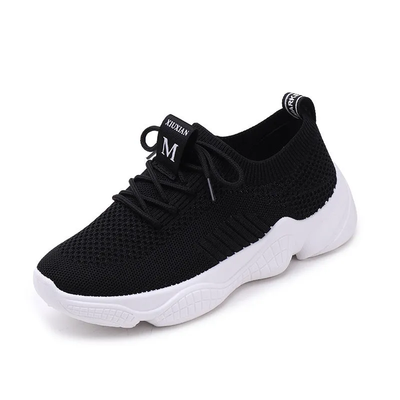 White thick-soled women's flyknit trainers with front strap and rubber sole.
