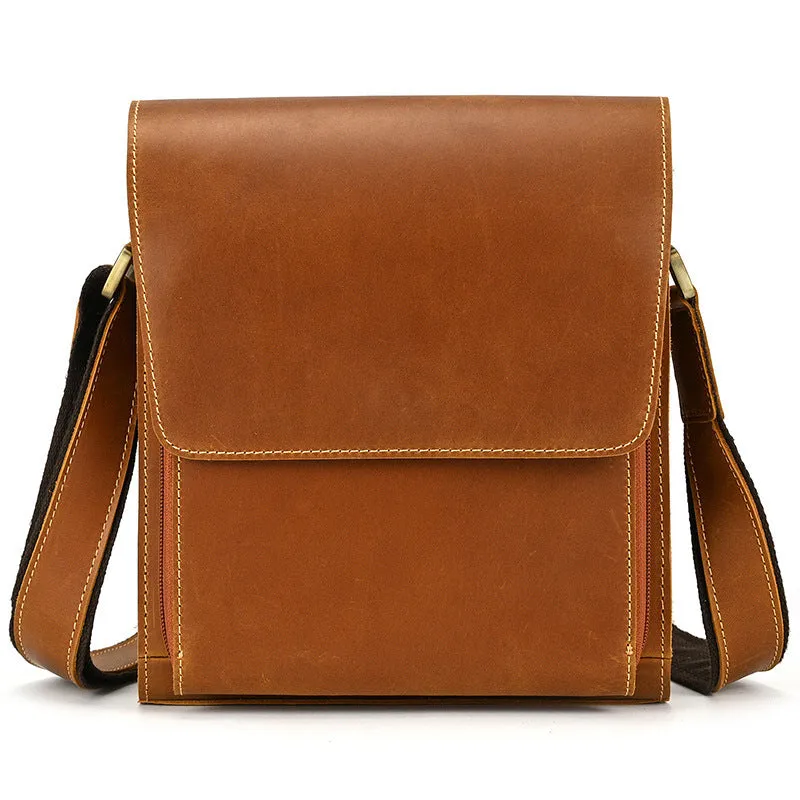 Men's brown leather shoulder bag with flip shoulder strap showing sewing line details and retro design